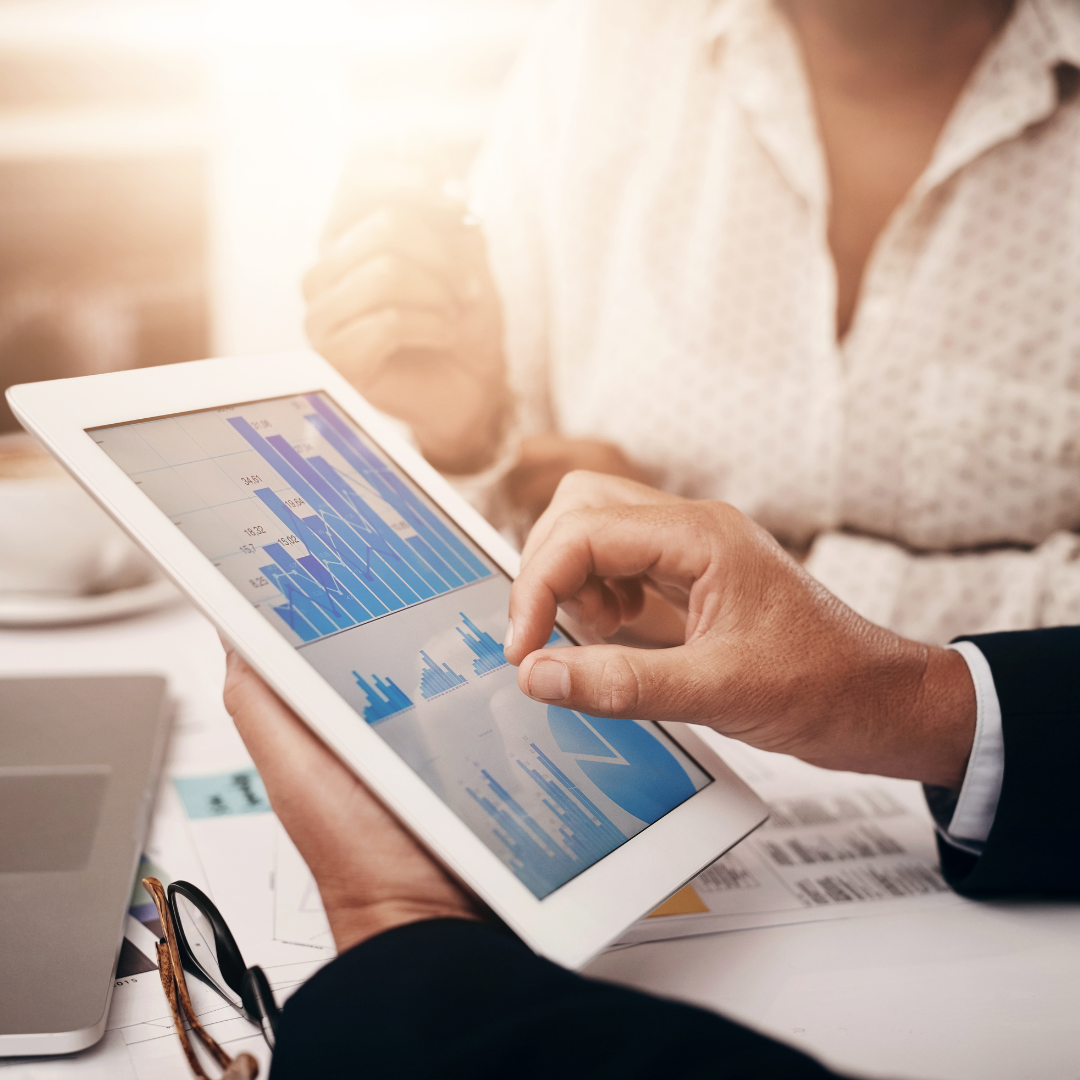 Stock image of digital data being reviewed in a team